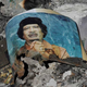Illustration for article titled Holy Crap Qaddafis Corpse Is Being Stored in a Freezer at a Mall